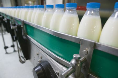 Woolworths to continue milk levy