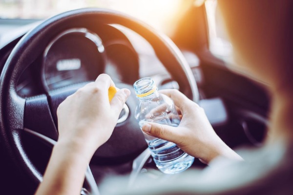 Can you get fined for drinking WATER while driving?