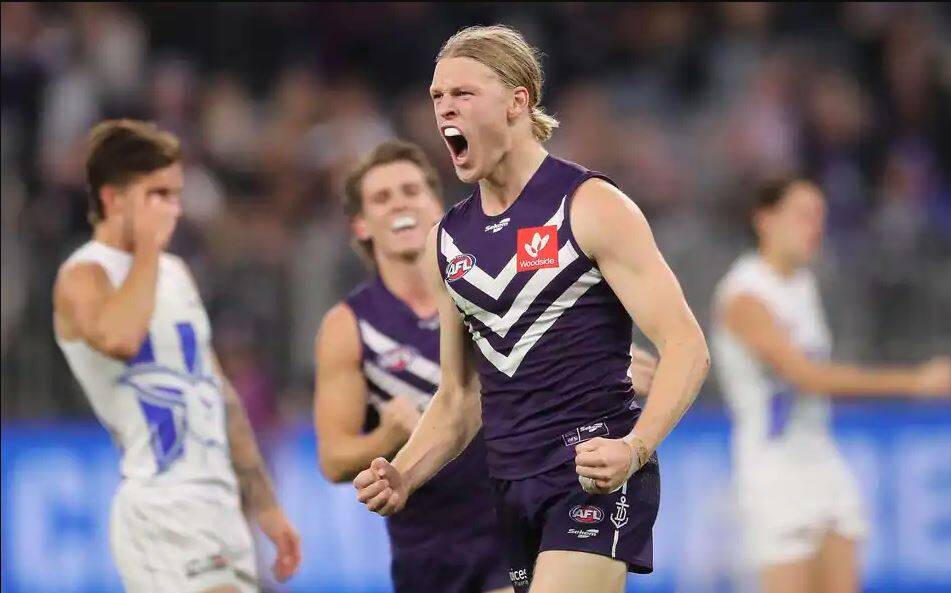 Article image for The Dockers smash the Roos under Friday night lights