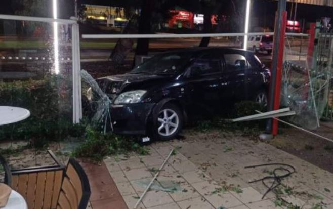 Article image for Errant driver crashes through Hungry Jacks entrance