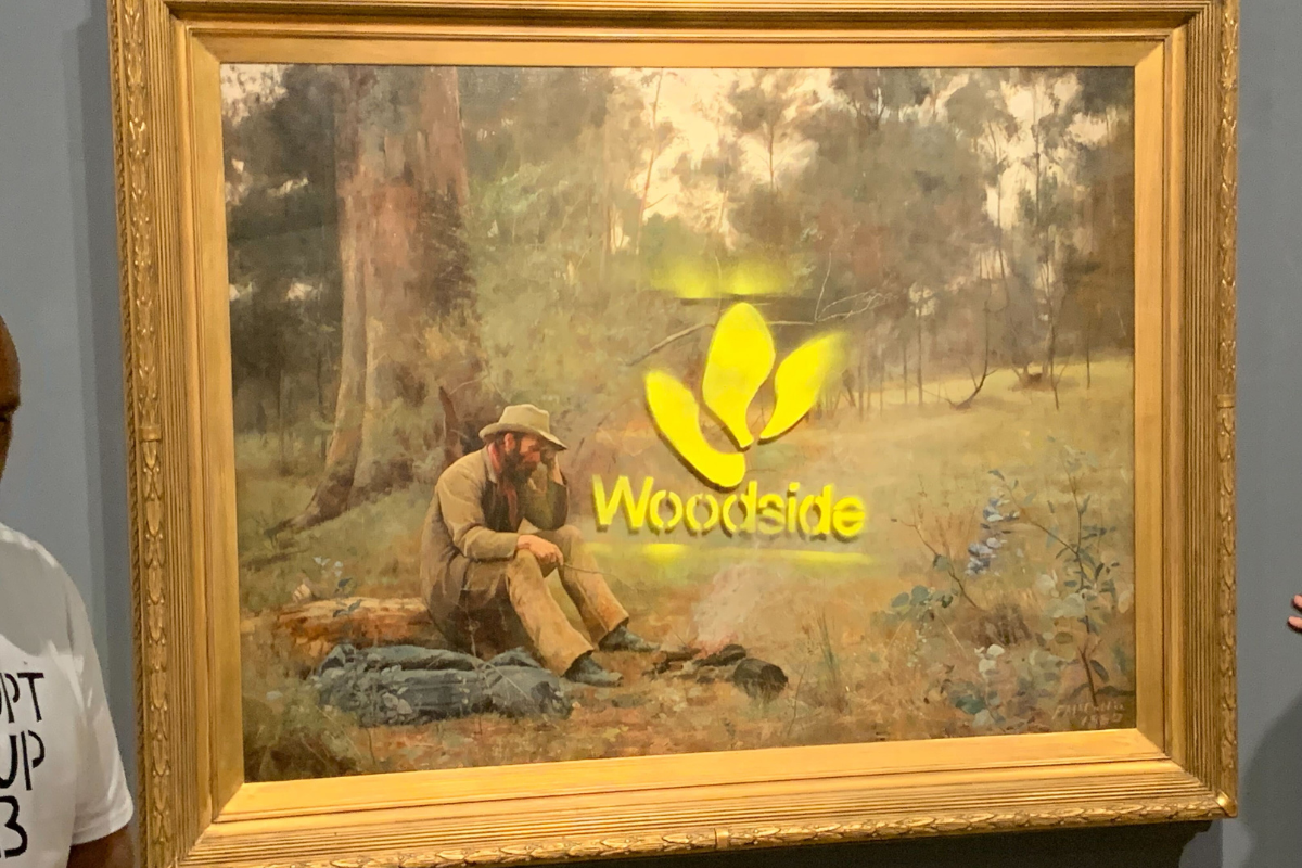 Protesters deface iconic Australian painting with Woodside logo