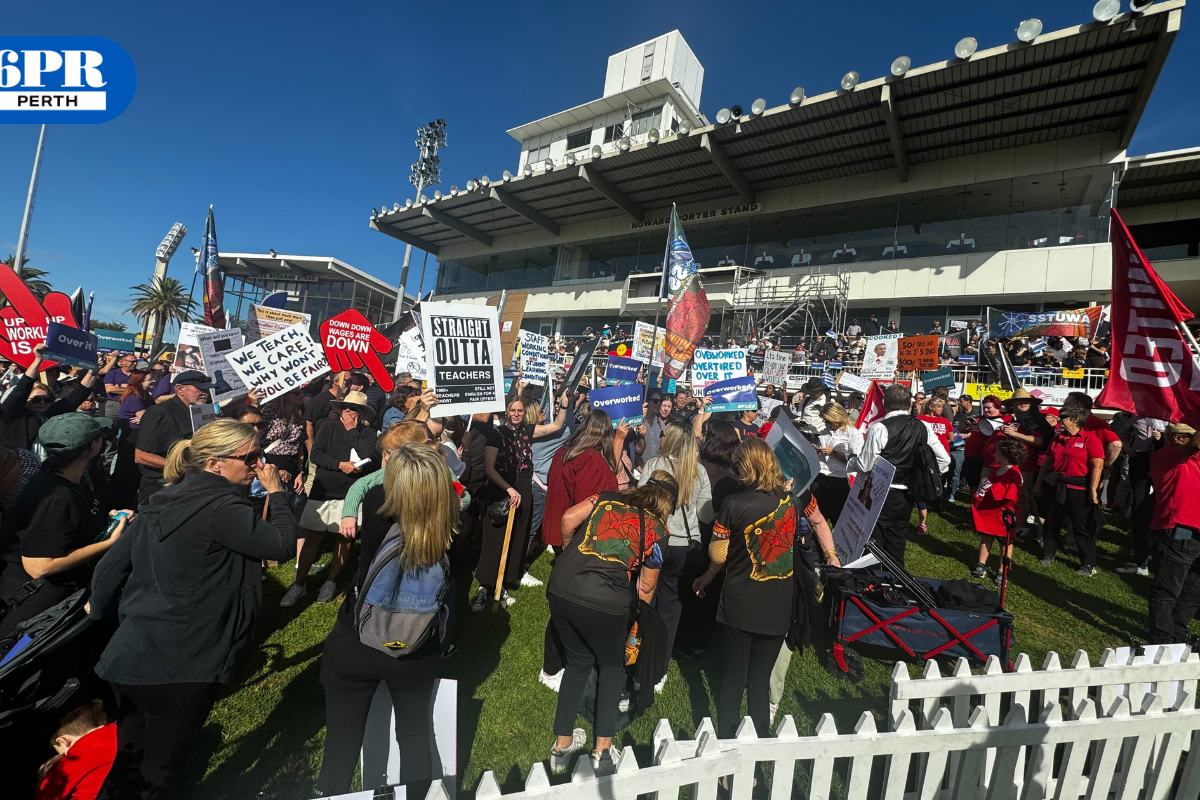 Article image for Thousands of WA teachers march across Matagarup Bridge in first strike action