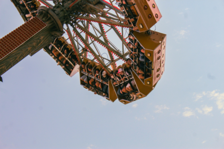Theme park patrons stuck upside down on an amusement ride