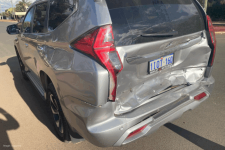Incredible hit-and-run: Ute and caravan push empty car 100m before fleeing